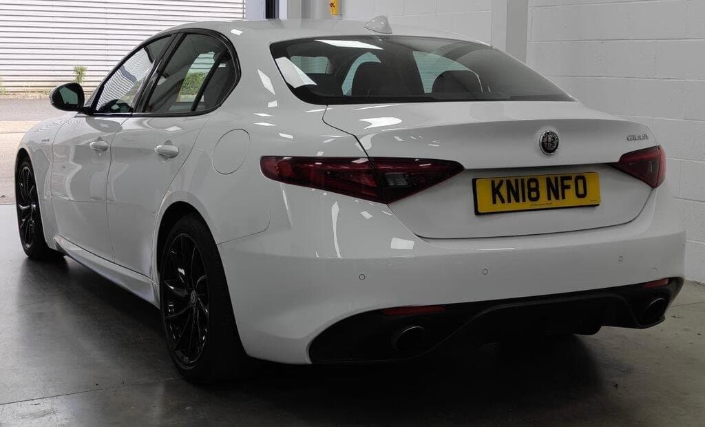 Alfa Romeo Giulia Veloce in White, rear three-quarter view, closer angle