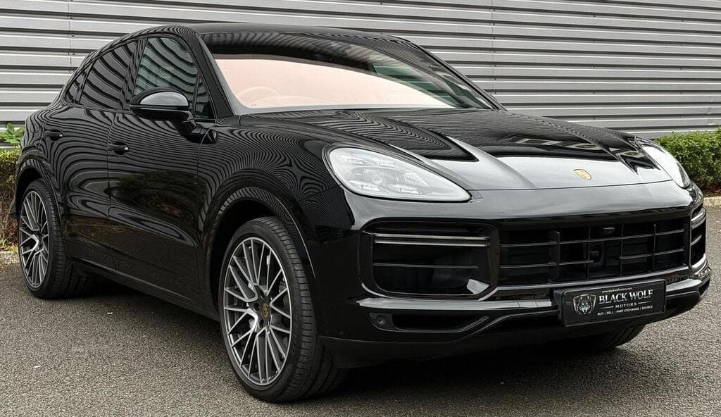 Porsche Cayenne Turbo in Black, three-quarter front view, closer angle