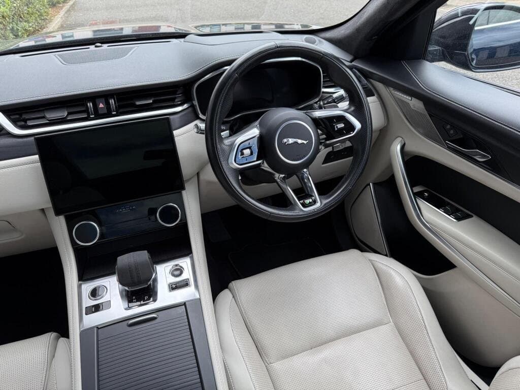 Jaguar F-PACE steering wheel and R badge close-up