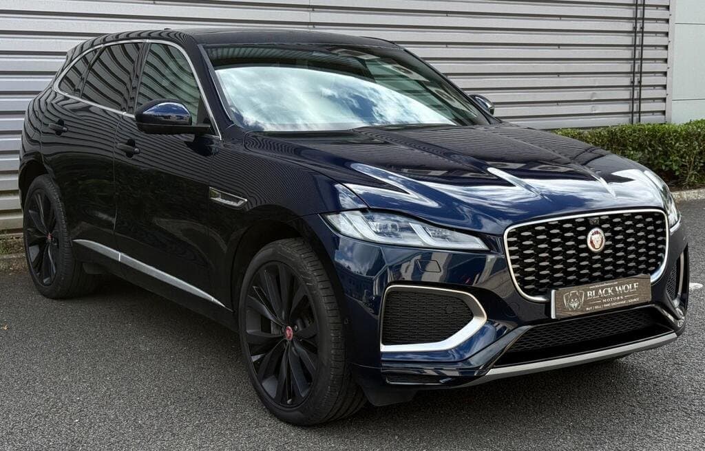 2021 Jaguar F-PACE in Blue, three-quarter front view in a studio setting