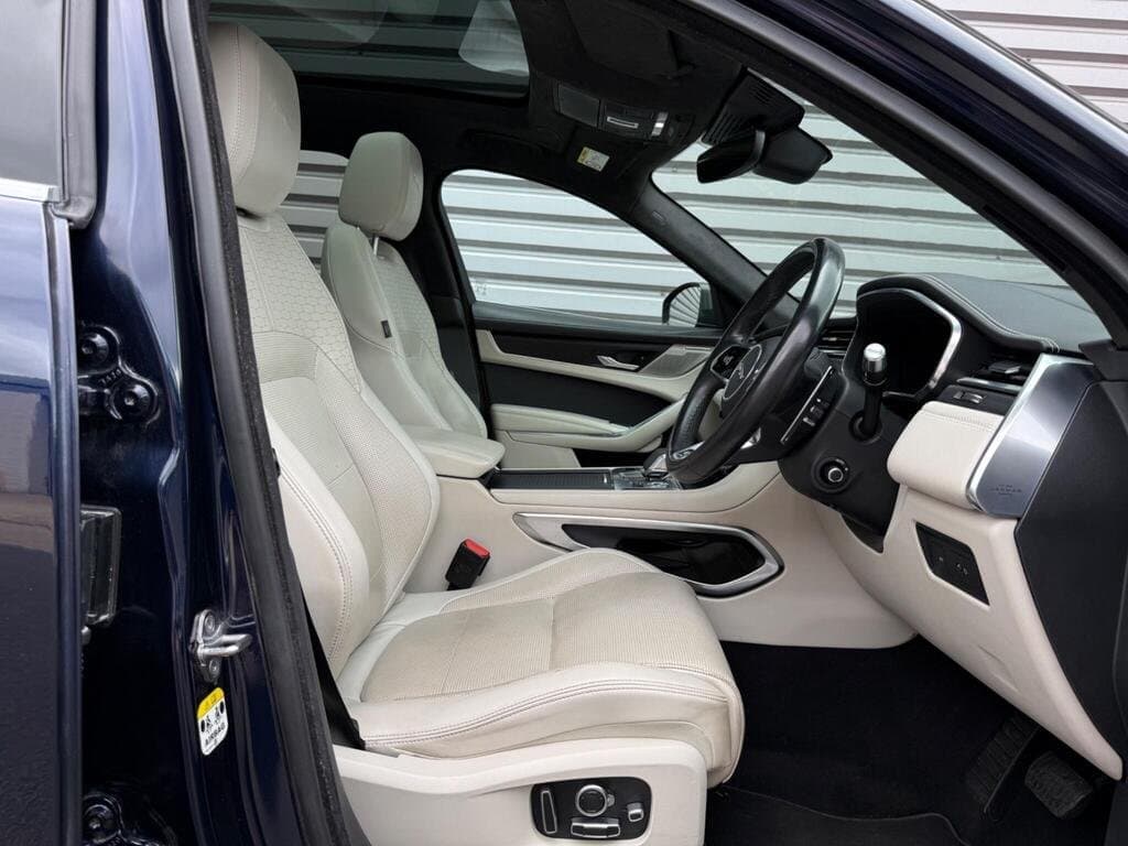 Jaguar F-PACE front cabin viewed from the driver's door