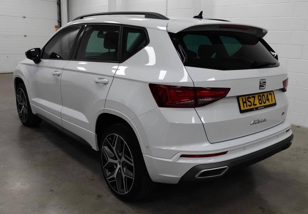 SEAT Ateca FR Sport in White, rear three-quarter view, showroom setting